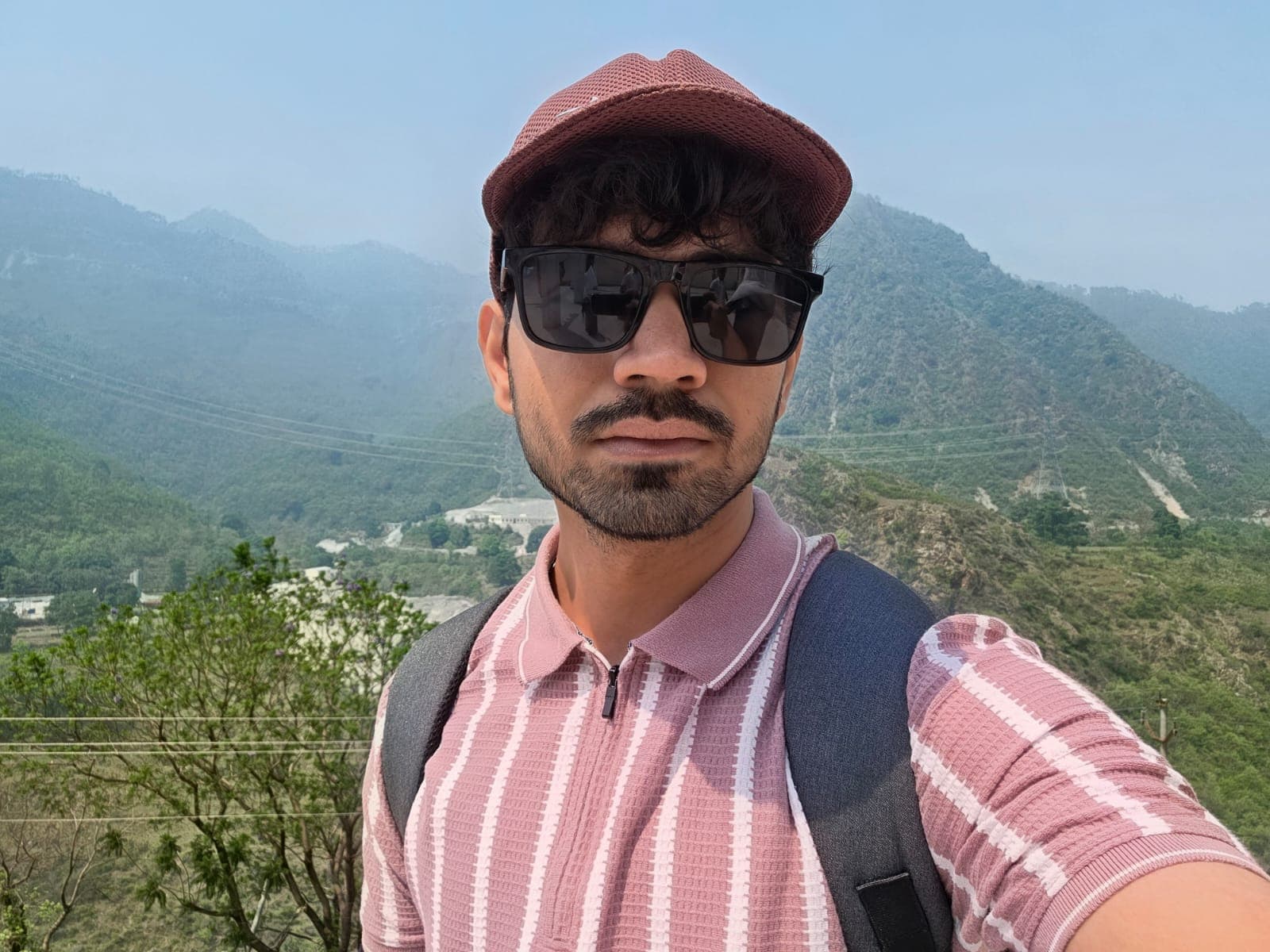 Abhay standing in front of the mountains